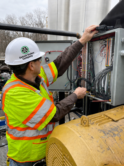 DSC Service Consultant Working on Control Panel